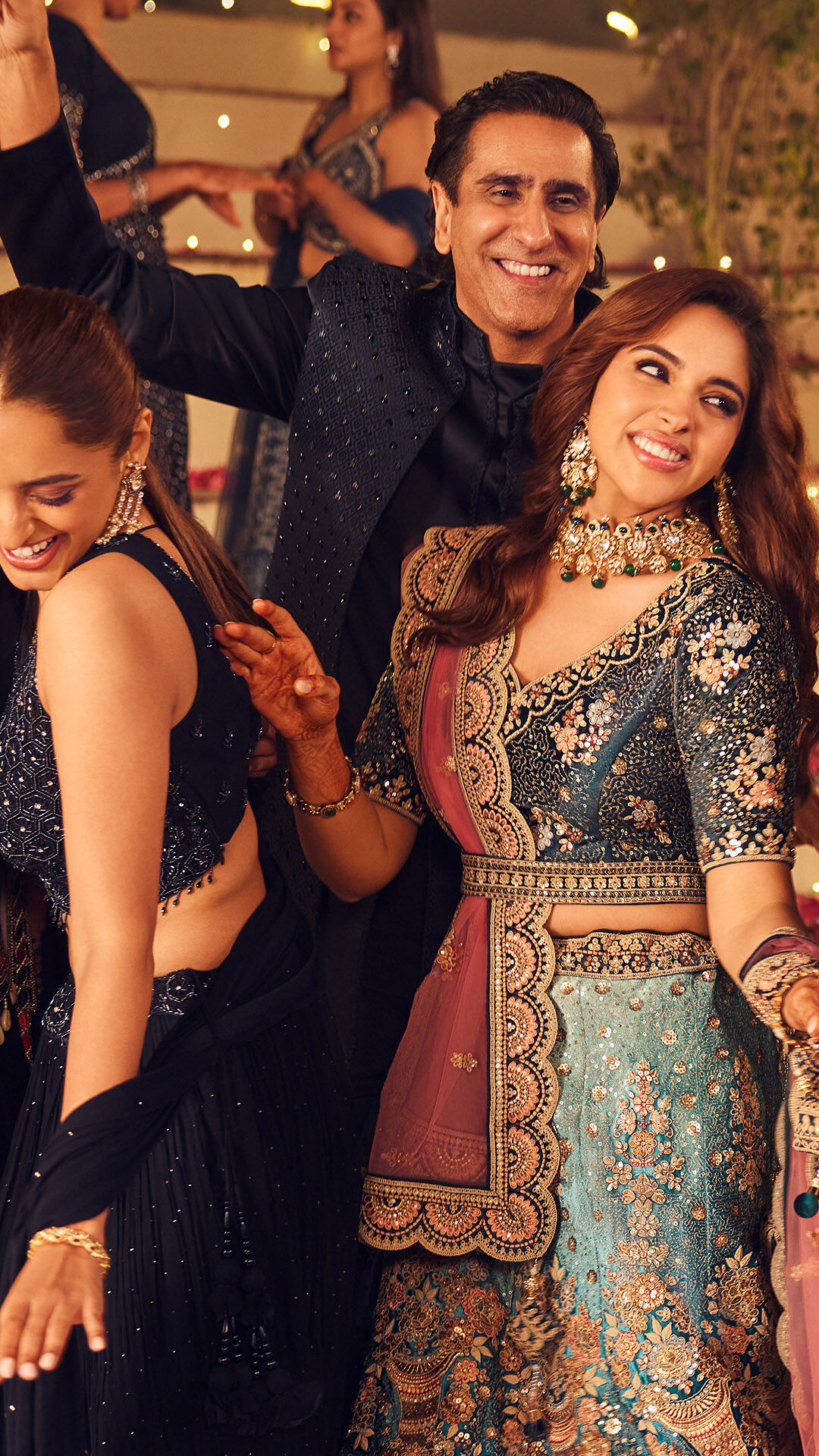bride and her father wearing traditional wedding attire and dancing and enjoying in wedding ceremony